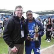 Top man - Colchester United winger Jayden Fevrier is presented with his Hospital Radio Colchester player of the year award by Chris Liddamore