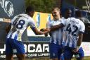 Team spirit - Colchester United goalscorer Harry Anderson celebrates with his team-mates after firing them ahead at Mansfield Town