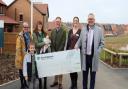 Support - Julie Kett, receptionist and lead fundraiser, Vinnie, Beth Deacon-Bates and baby Clara, Councillor Simon Dowling, Abi Corbett, of The Sick Children's Trust, Ian Hamilton, MD of Persimmon Homes Suffolk