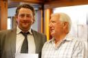 Andy Pestell receiving his prize from club captain Jim Wilkinson