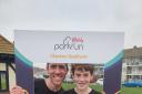 Matt and Sam Plummer celebrate their 100th Parkrun