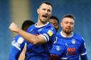 Cheers - Colchester United captain Tommy Smith celebrates scoring last season Picture: STEVE BRADING