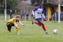 On the ball: Witham Town's Deese Kasinga-Madia brings the ball away against Basildon United. Picture: NIGEL HAKES