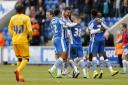 Jubilant - Colchester United's players celebrate following their dramatic final-day win over Preston North End, in 2015