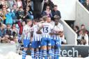 Team effort - Colchester United are aiming to claim a big victory over leaders Stockport County tonight