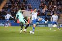 Tussle - Colchester United striker Tom Hopper battles for the ball during his side's clash with Stockport County