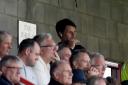 Vantage point - Colchester United head coach Danny Cowley watches his side's game at Crawley Town from the stands