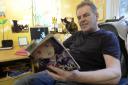 Author Jason Cattrell who publishes under the name D J Cattrell, at home in his studio in Great Horkesley..