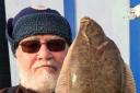 Prize-winning catch: Colchester Sea Angling Club member Bill Paqutte with his winning flounder, caught during the match at Holland-on-Sea.
