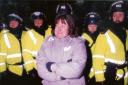 Tearful – a woman watches the Brightlingsea drama unfold, surrounded by police officers