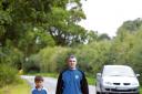Chairman Paul Oliver and son Ronnie, nine, show where they have to walk