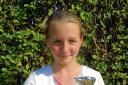 Young star – Olivia Frost with her three trophies