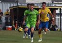 Tussle: Braintree Town's Alfie Payne (green shirt) battles for the ball against Canvey Island.