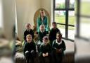 Happy - headteacher Hannah McCann pictured with Gosbecks pupils