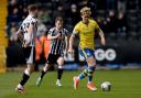 On the ball - Cameron McGeehan in midfield action during Colchester United's game at Notts County