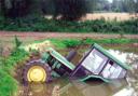 Partly submerged - the John Deere tractor in the pond at Mill Pond farm, Little Oakley, after the mishap involving Gary May. Picture: SUBMITTED