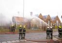 Wrecked - Essex firefighters tackle the flames at the old Harwich Primary School site. Picture: RUTH RING
