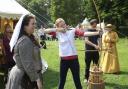 Medieval festival Colchester Castle Park.Hannah Wallace tries archery.
