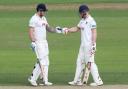 Team work - Matt Coles (left) touches gloves with Simon Harmer during Essex's game with Nottinghamshire Picture: GAVIN ELLIS/TGS PHOTO
