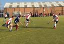 Tussle - action from Colchester Hockey Club's (white and red shirts) game at Felixstowe