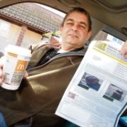 Fast fine – Dave Taylor with a coffee and the parking ticket he received for returning to McDonald’s within two hours