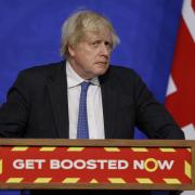 Photo of Boris Johnson as he pushes the Government's Get Boosted Now campaign in light of Omicron. Photo via PA.