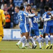 Jubilant - Colchester United's players celebrate following their dramatic final-day win over Preston North End, in 2015