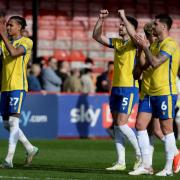 Away success - Colchester United's players applaud their fans after the 3-2 win at Crawley Town on Saturday