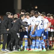 Team talk - Colchester United's players get instructions from head coach Danny Cowley during their defeat to Doncaster Rovers