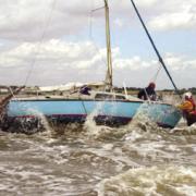 Help at hand - the lifeboat approaches the yacht on Mersea Flats...