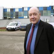 Committed - Dr Phliip Murray in front of the radiotherapy centre at Colchester General Hospital in 2013