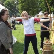 Medieval festival Colchester Castle Park.Hannah Wallace tries archery.