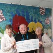 Smiles - Caroline Bates, head of fundraising, with Adam Jones and mum Shirley