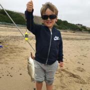 Oliver Rotchell spent the day fishing with his dad Daniel on the Holland beaches and is now hooked for life