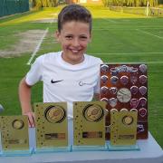 Net gain - Otto Friedlein with his trophies following his success in the Colchester and District Tennis League