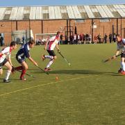 Tussle - action from Colchester Hockey Club's (white and red shirts) game at Felixstowe