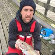 Great start: Daniel Tulip with a fresh run codling, caught from Walton Pier on his first cast of the day.