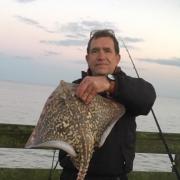 Successful trip: John Popplewell fished an evening tide on Walton Pier and was rewarded with this 9lb thornback ray.