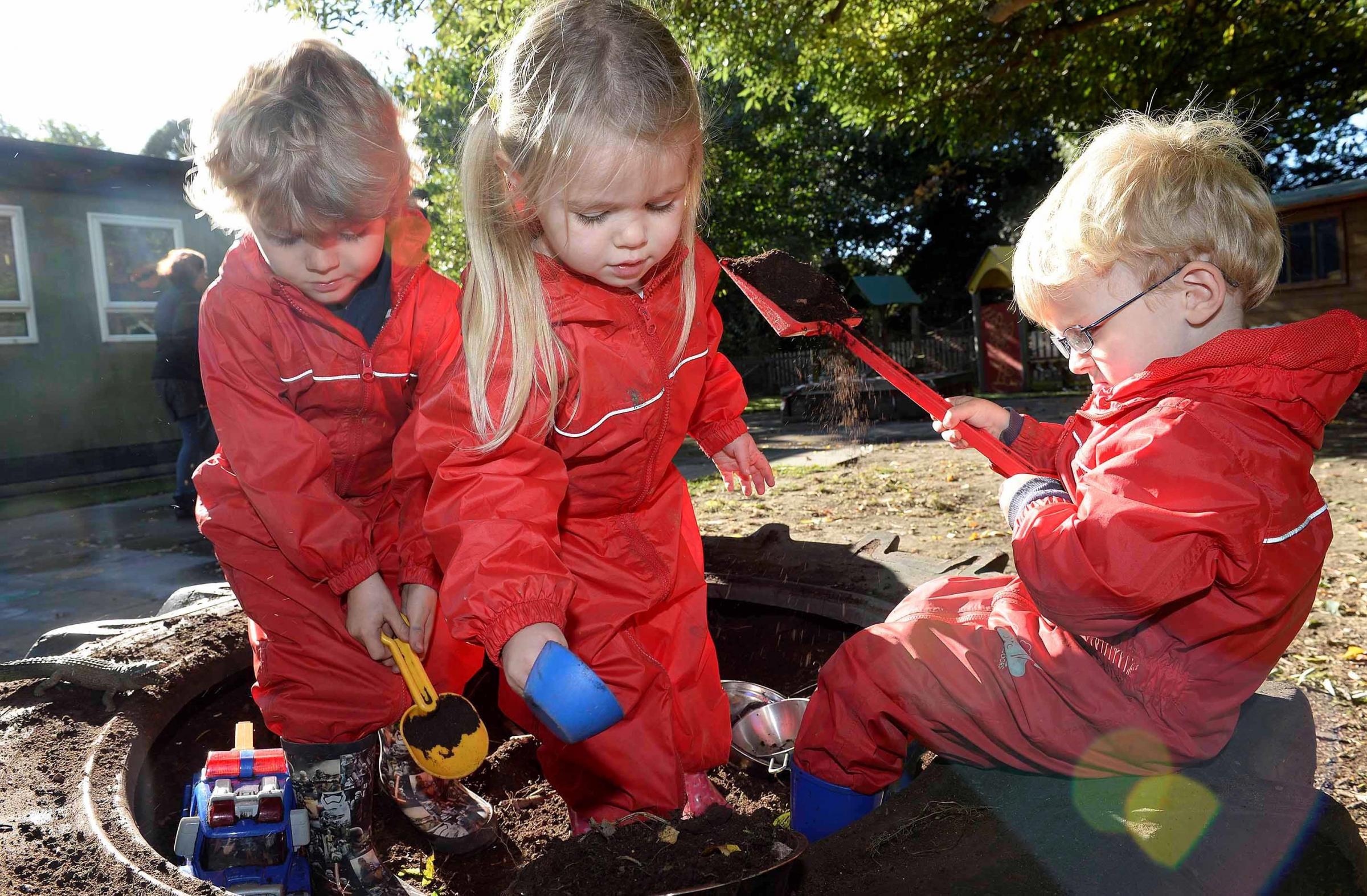 PICTURES: Mud pies anyone? Youngsters get stuck into new mud kitchen