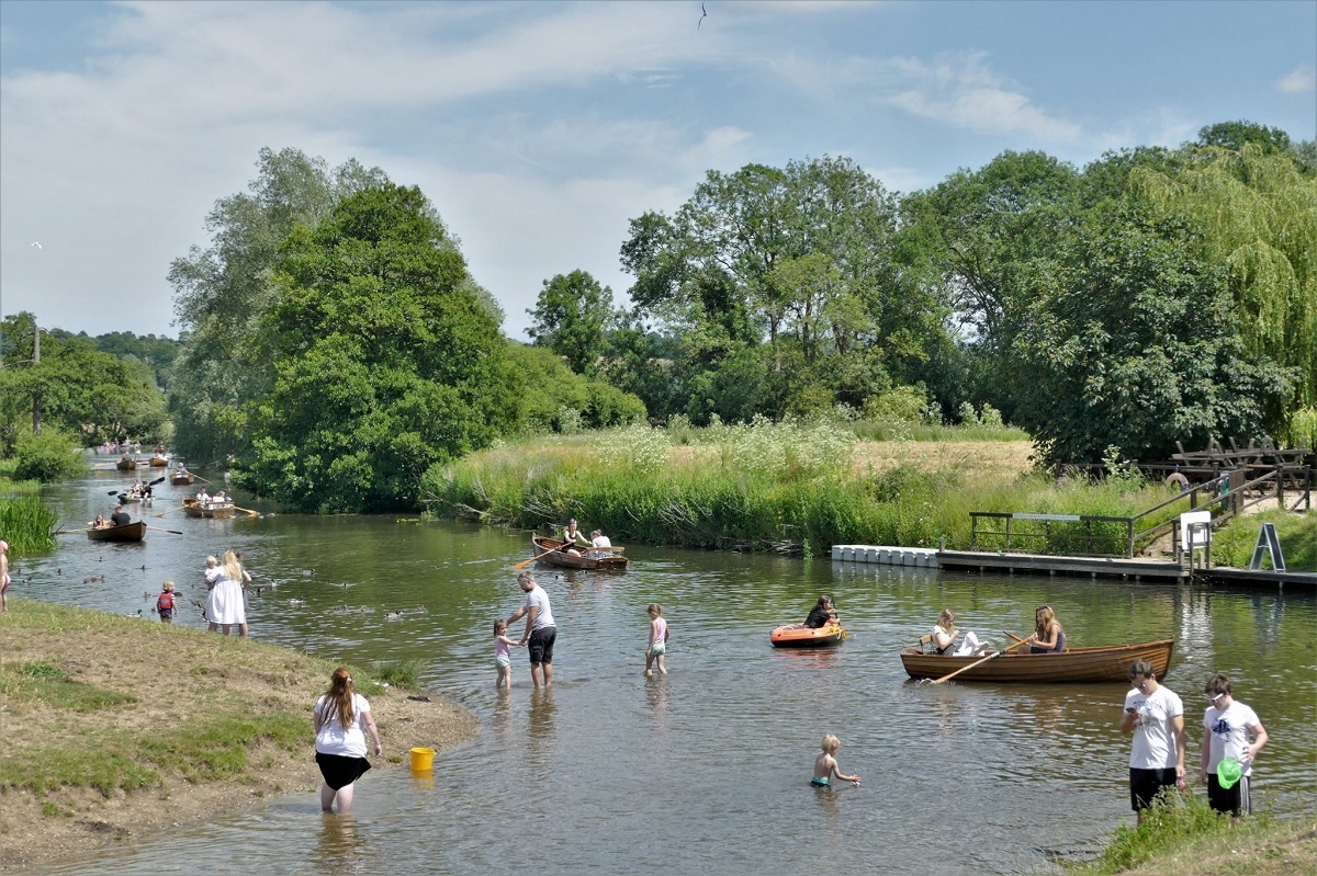 Cheryl Holland. A hot day at Dedham yesterday, people cooling off in the river.