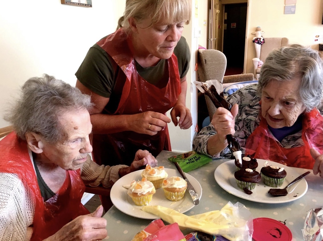 Sweet treats - Debra Jackson with residents at Oaklands Care Home, in Brightlingsea