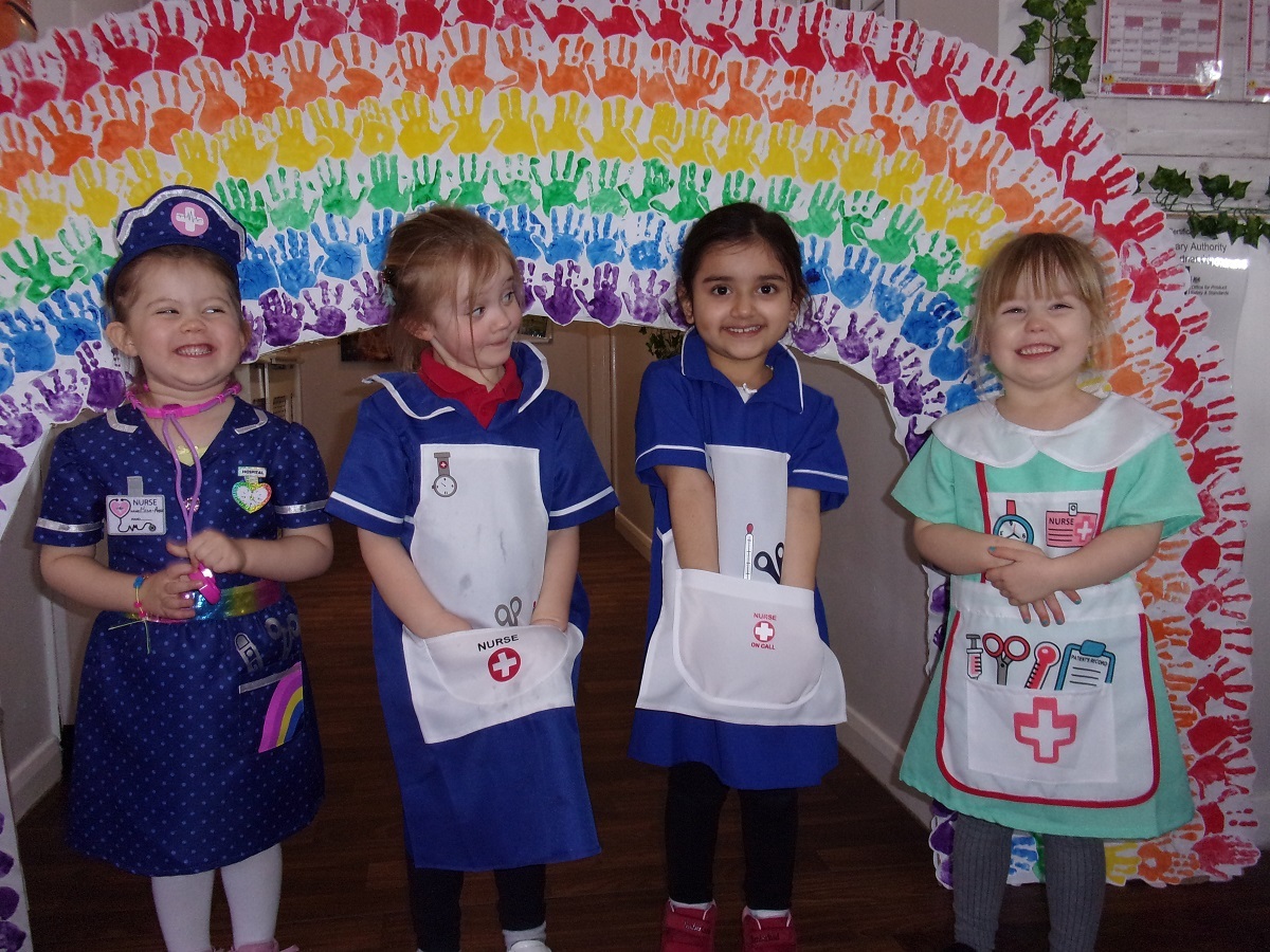 Helping others - Mila-Rose Mayatt, Eliza Aitkinson, Sienna Basra and Lily Hughes dressed up as nurses at Busy Bees Day Nursery