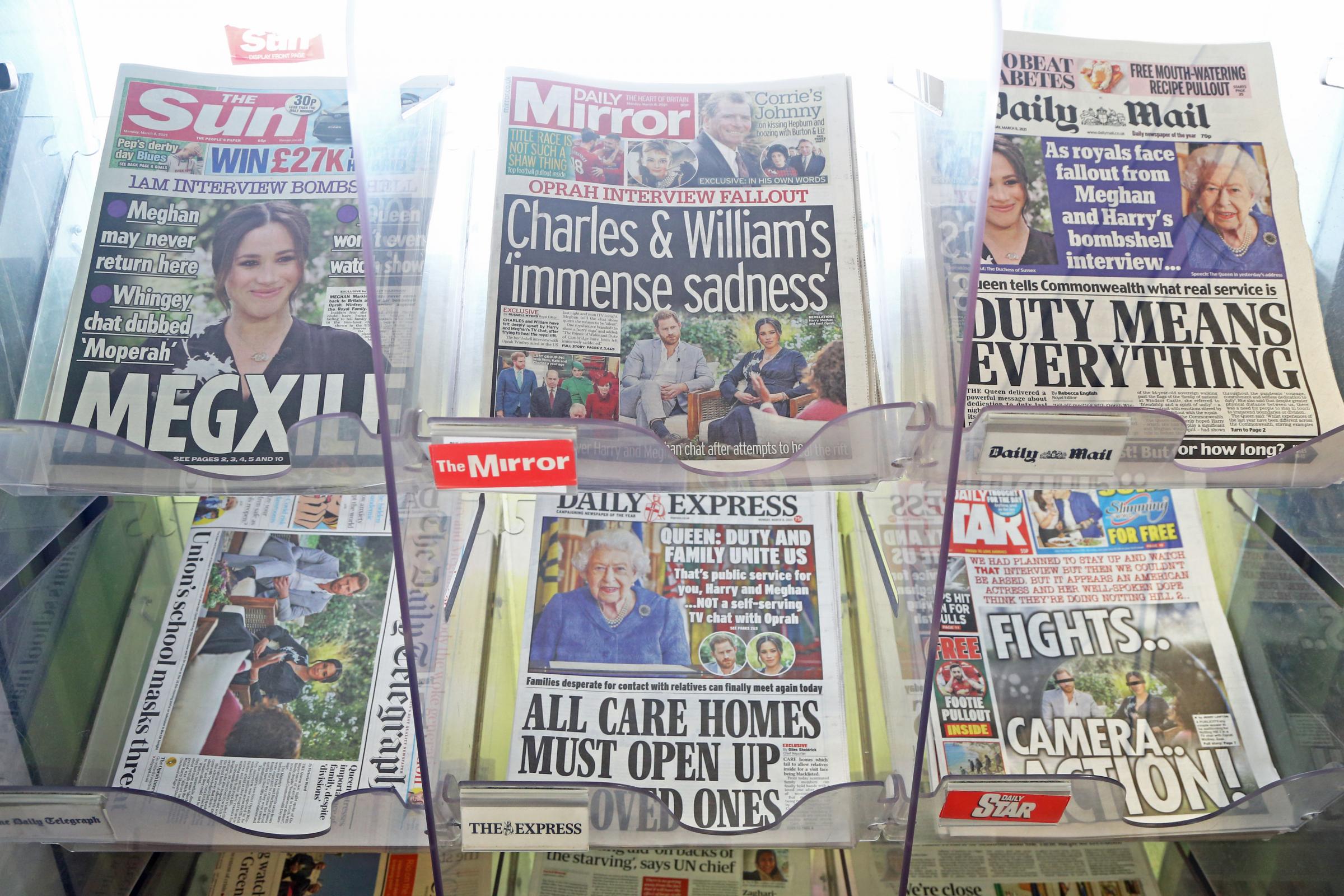 The front pages of newspapers on sale at a garage in Dover, Kent. The Duke and Duchess of Sussex have plunged the monarchy into a crisis, accusing an unnamed royal of racism, suggesting the family were jealous of Meghan and revealing that she