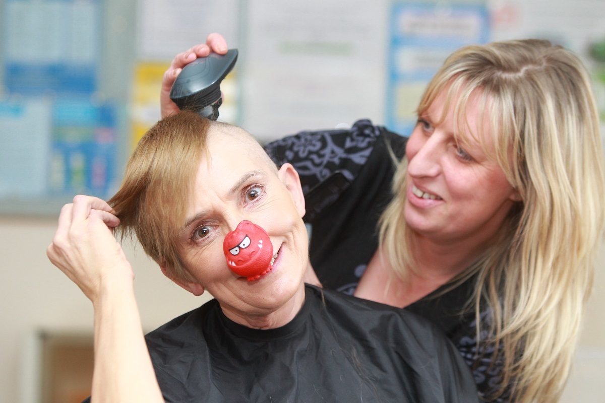 A bald move - Joy Harrison had her head shaved at Ardleigh Surgery, in Dedham Road, in 2013. Also pictured is hairdresser Emma Thrower