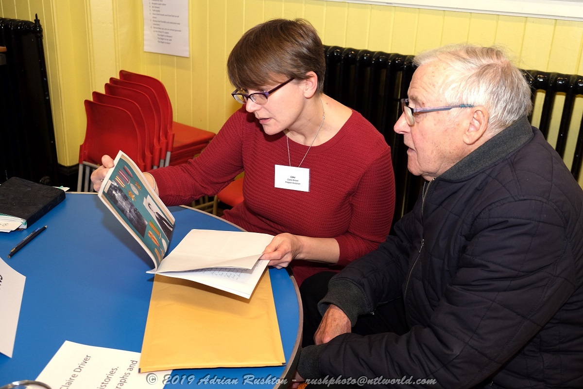 Listening intently - historian Claire Driver (left) with Michael Wood at the CXXV Open Day, donating family photographs to the school archive Picture: ADRIAN RUSHTON