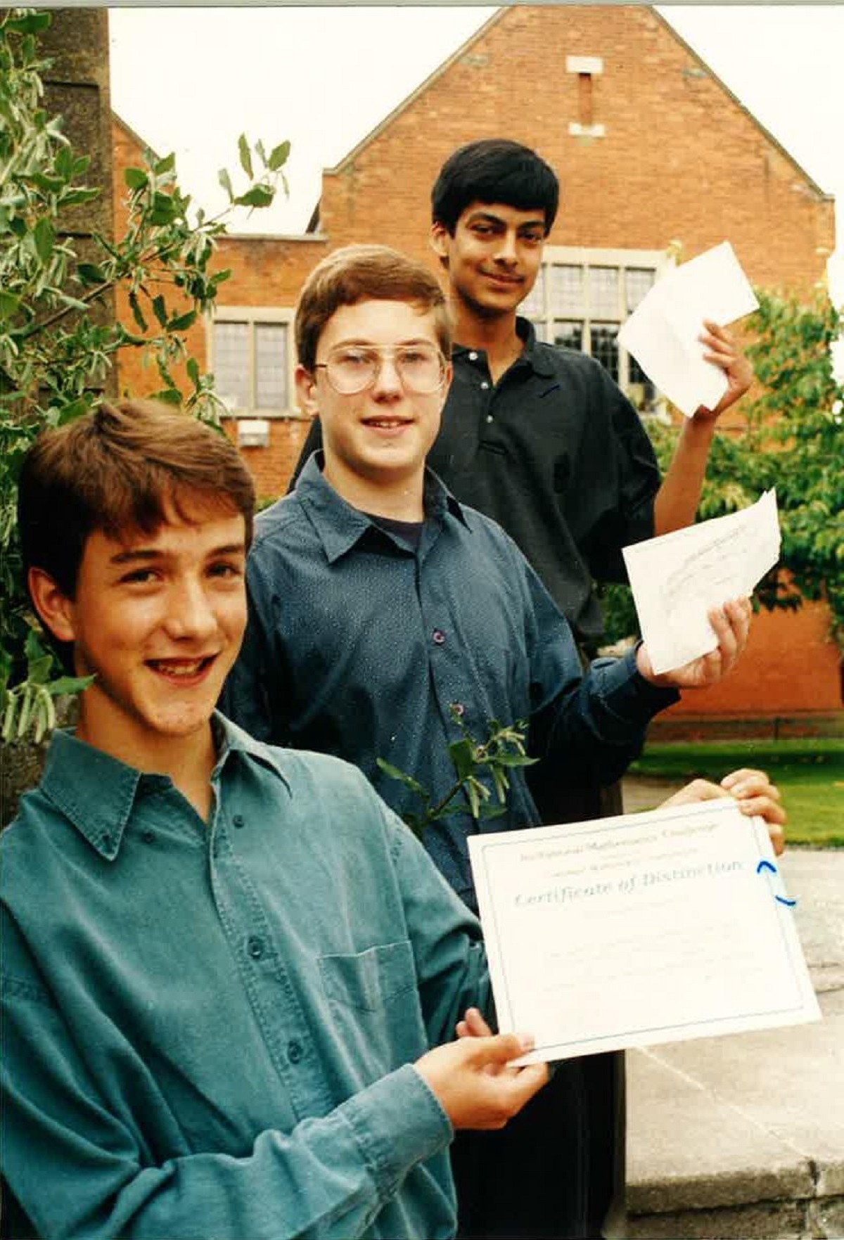 Top marks - pictured from left are Edward Crane, Neil Edwards and Amar Singh with their A-Level results in September 1993