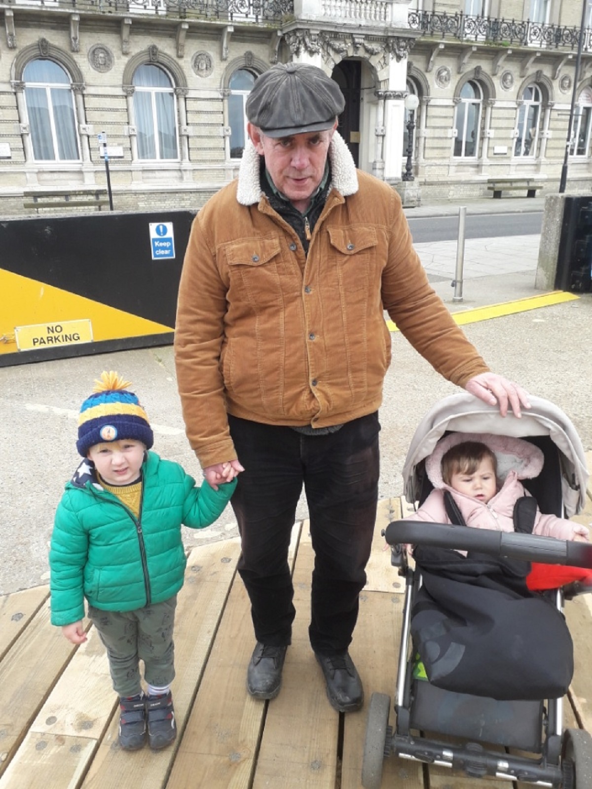 With two of his grandchildren - John with James, three, and Sophia, two