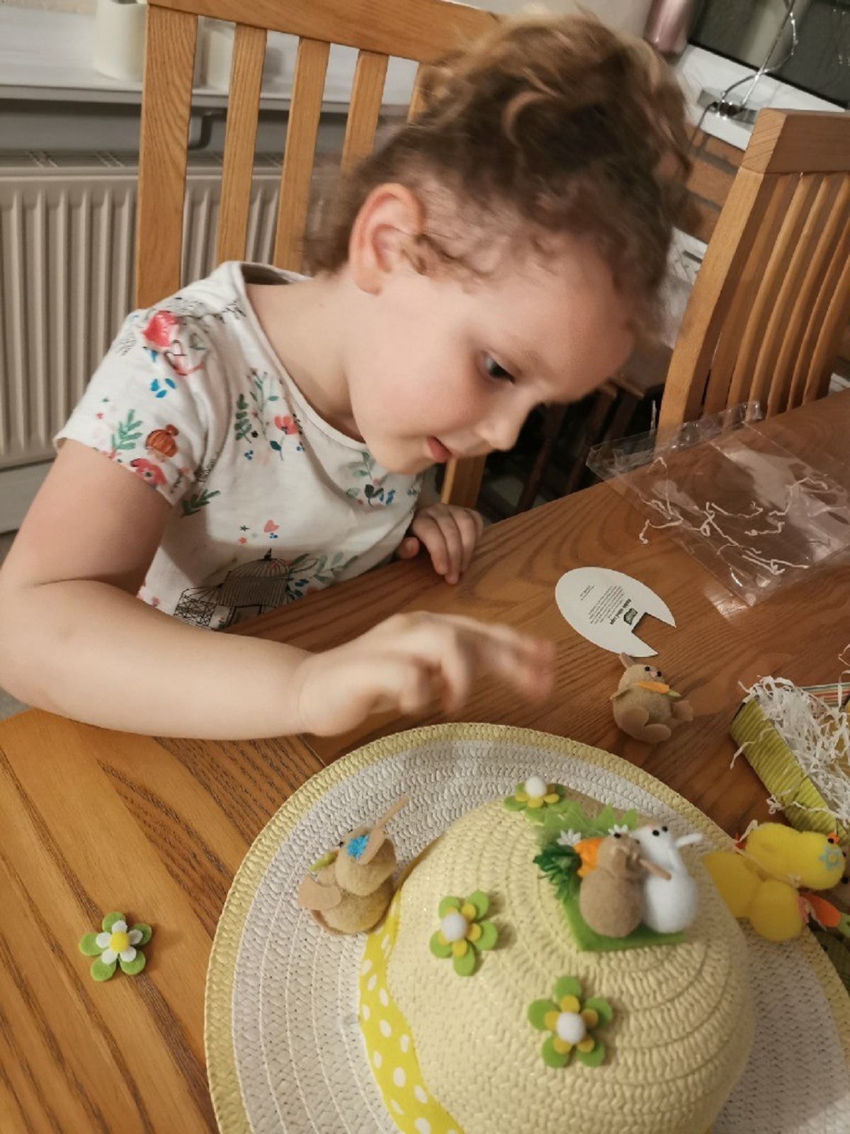 Sticking to her task - Isla Grace Gillet decorates her Easter bonnet