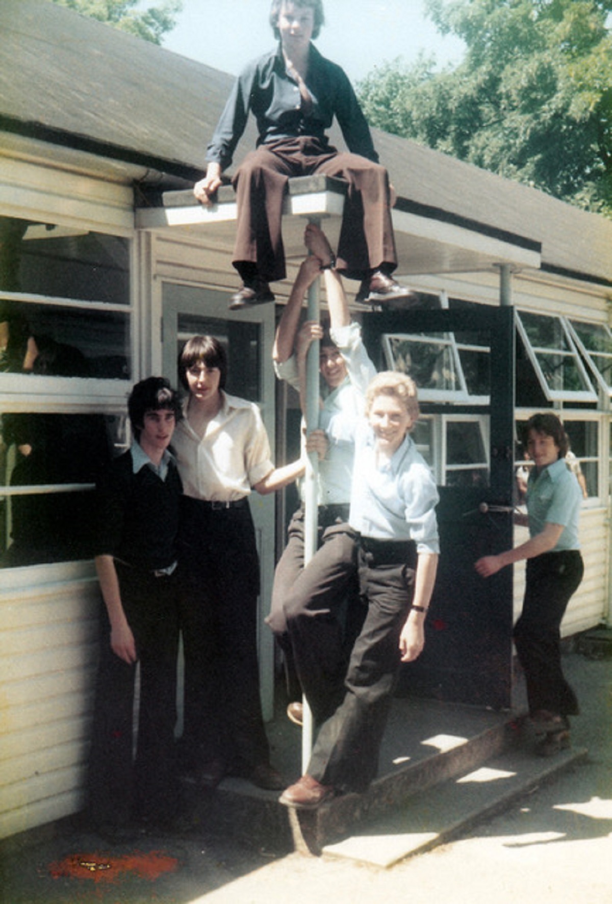 On a real high - students outside the old language huts in the mid-1980s