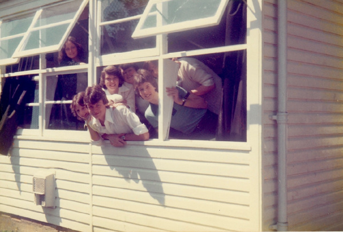 Getting some air - language students pose at the window for a picture taken in the 1980s